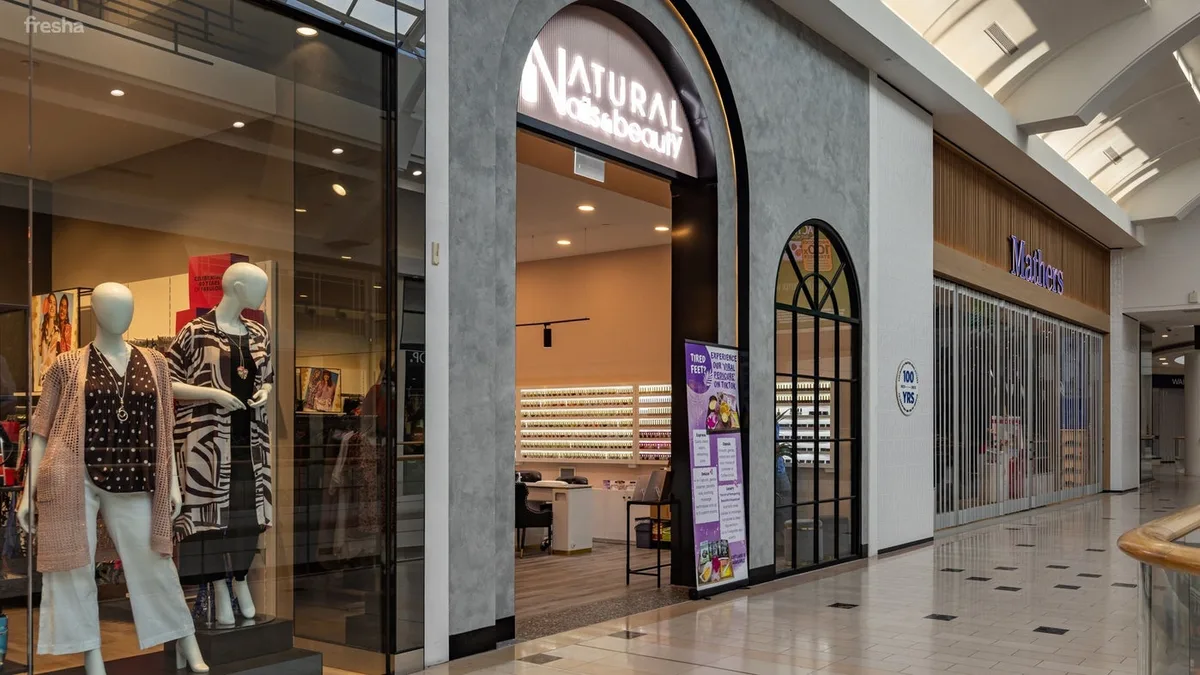 Entrance of Eastland Natural Nails & Beauty with arched glass windows